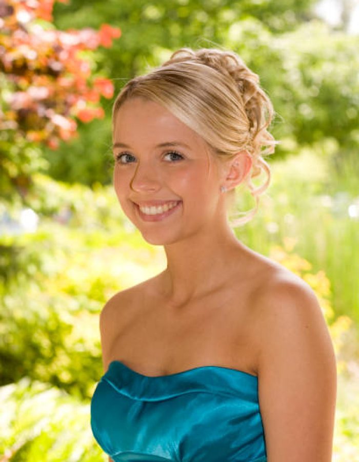 Beautiful teenage girl dressed up for her highschool prom.
